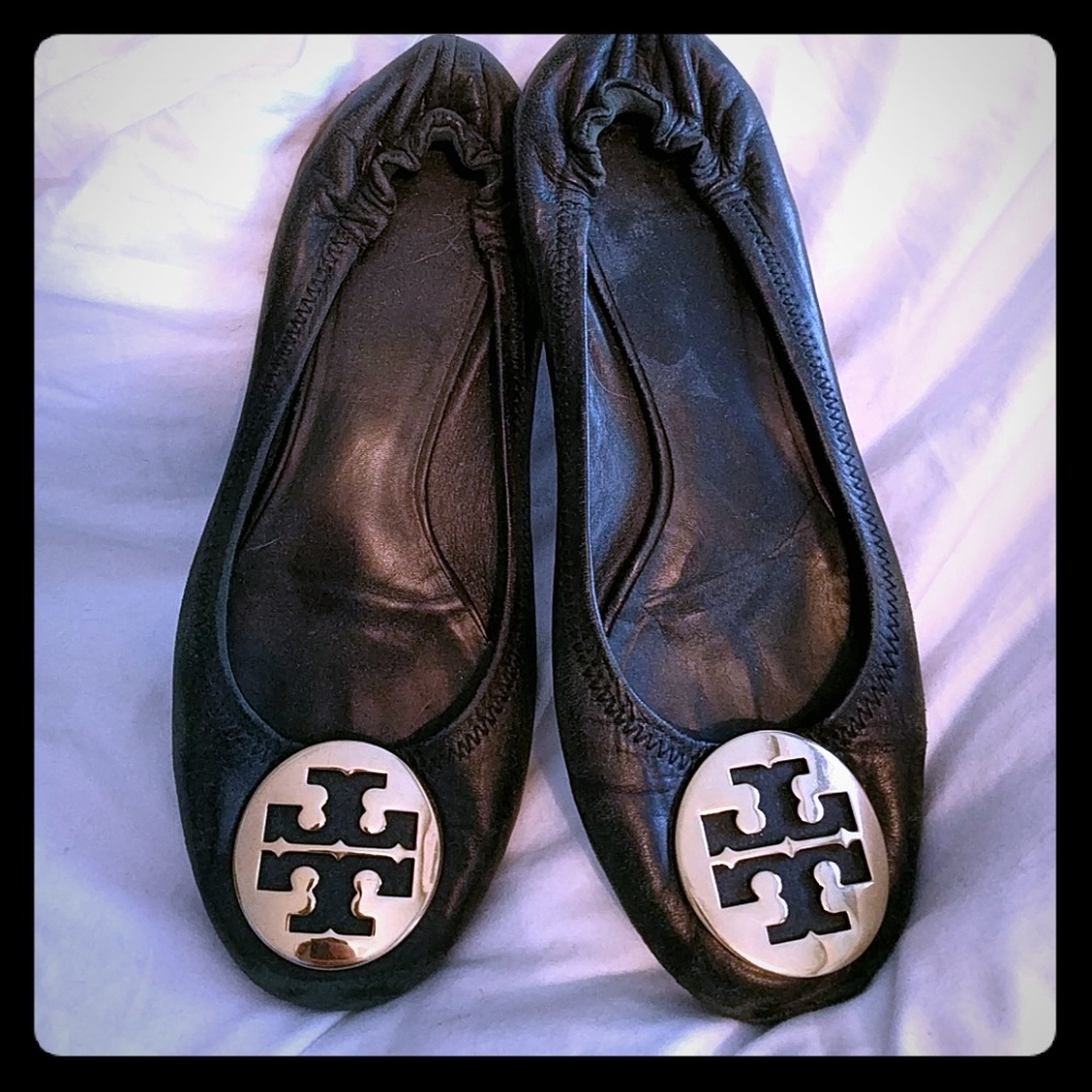 Well loved black reva flats